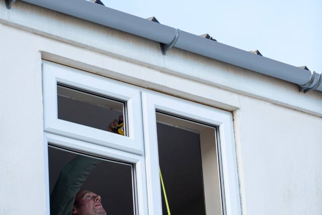 Worker Installing New Windows In House